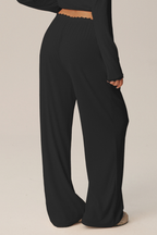 Pantaloni ampi Giselle con fascia in pizzo