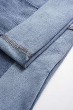 Paçaları kıvrılmış geniş paçalı kot pantolon